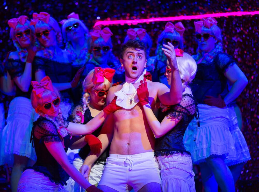 Tom Rakewell (Ben Bliss) falls captive to Mother Goose’s ladies (Photography by T Charles Erickson © T Charles Erickson Photography).