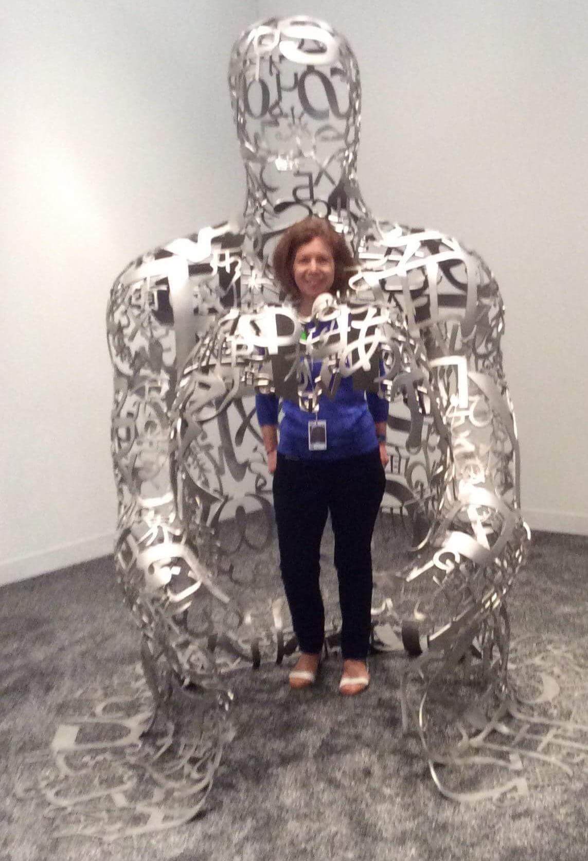 Nancy Nesvet with Jaume Plensa’s sculpture in the Collectors Lounge at Art Basel Miami Beach 2017.